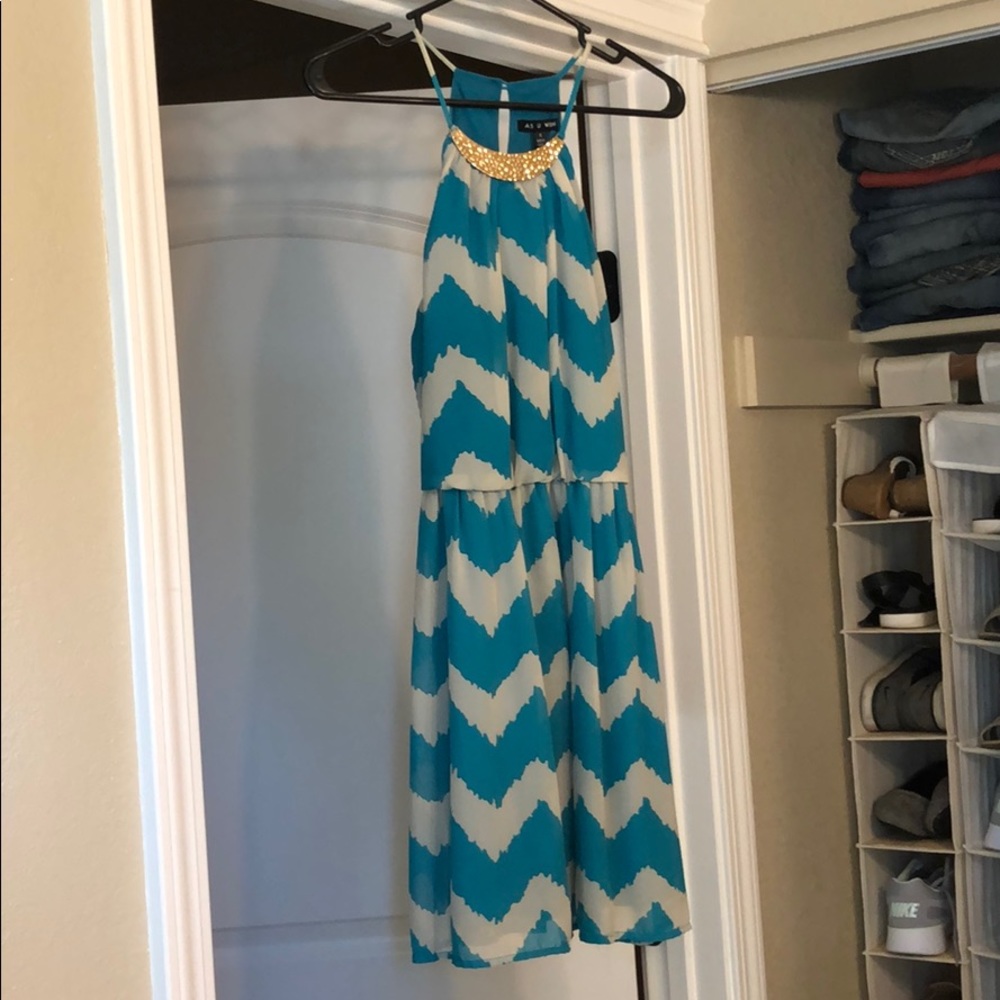 Patterned teal and gray dress.